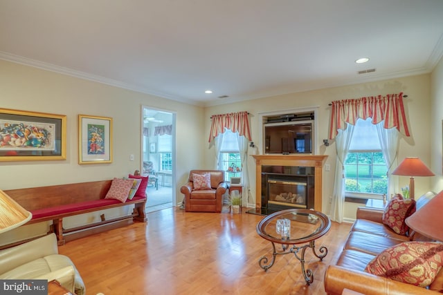 73 Springmill Dr, Middletown, DE 19709 - living area featuring wood finished floors, a tiled fireplace, crown molding, and recessed lighting