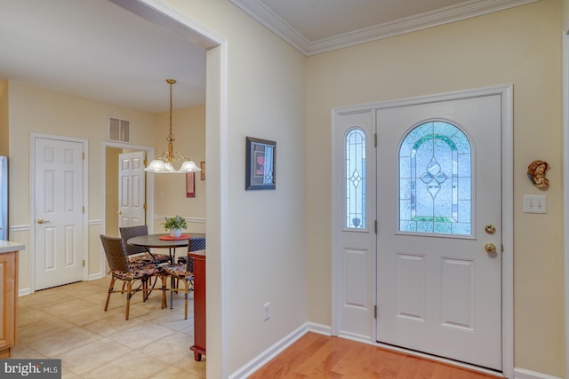 73 Springmill Dr, Middletown, DE 19709 - foyer entrance with crown molding, a chandelier, and baseboards