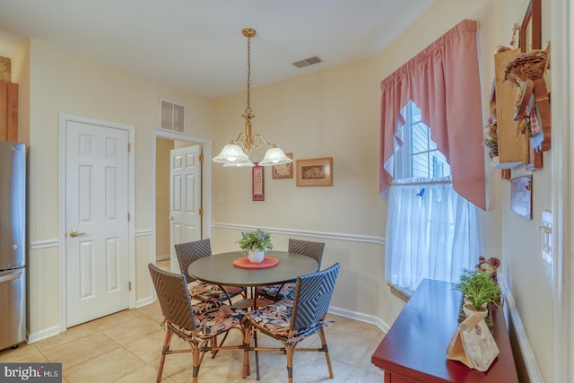 73 Springmill Dr, Middletown, DE 19709 - dining space with a chandelier, light tile patterned floors, and baseboards