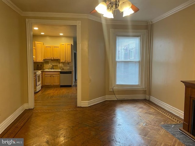 102 N 11th St, Reading, PA 19601 - unfurnished dining area with ceiling fan, baseboards, a sink, and crown molding