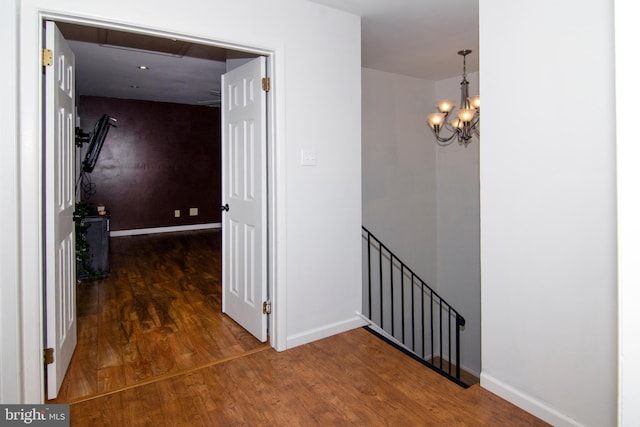507 Essex Ct, Mantua, NJ 08051 - hall with wood finished floors, baseboards, a chandelier, and an upstairs landing