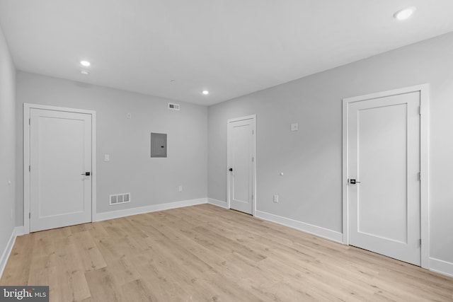 2937 Page St, Philadelphia, PA 19121 - spare room with electric panel, recessed lighting, light wood finished floors, and baseboards