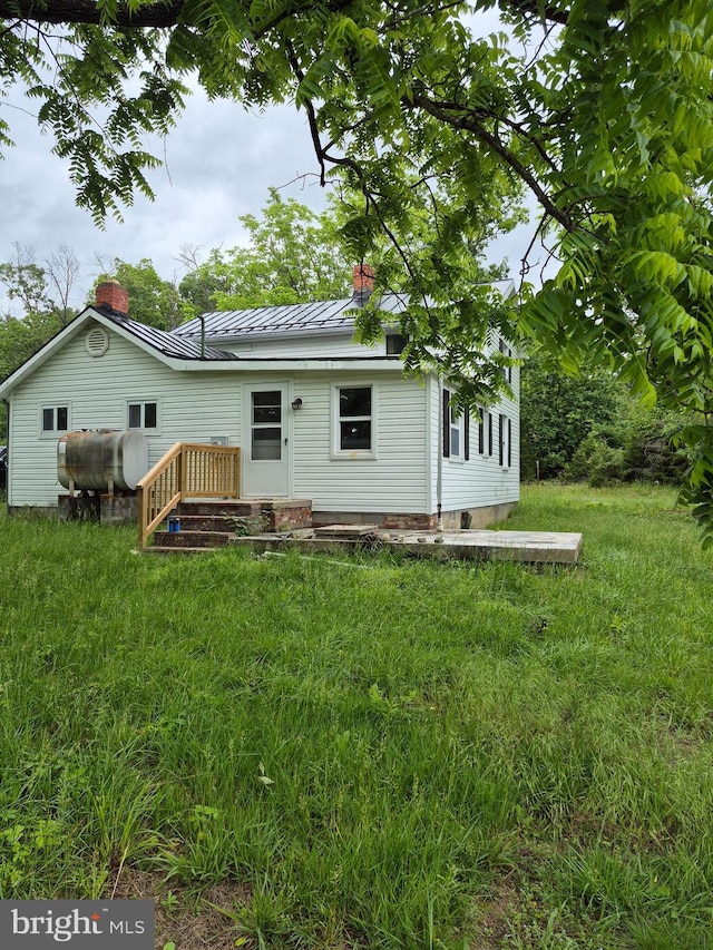 1106 Moreland Gap Rd, New Market, VA 22844 - back of property featuring heating fuel, a standing seam roof, a chimney, and metal roof