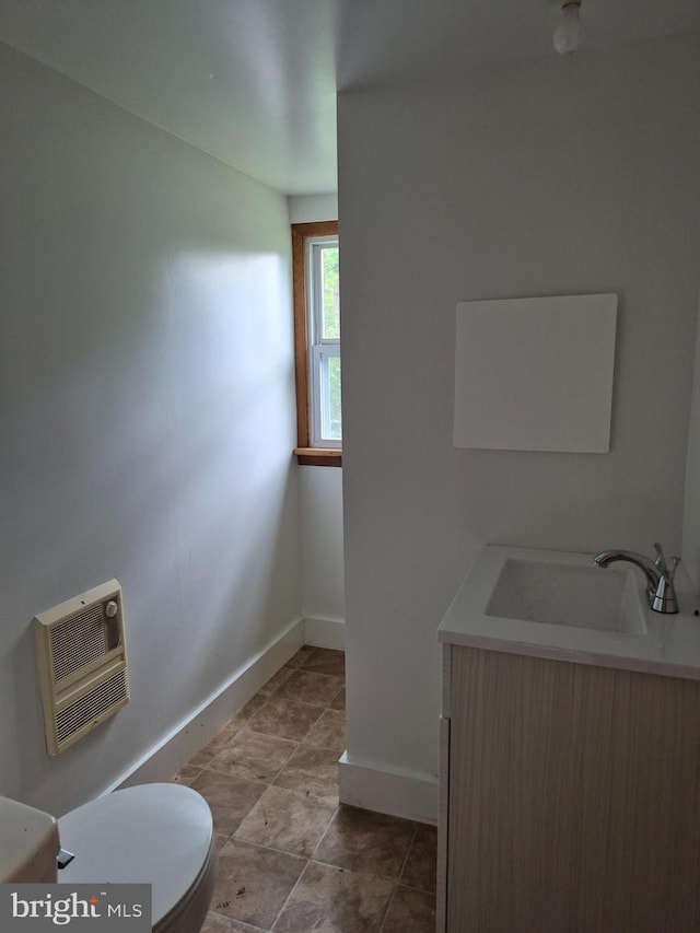 1106 Moreland Gap Rd, New Market, VA 22844 - half bath featuring baseboards, vanity, heating unit, and toilet