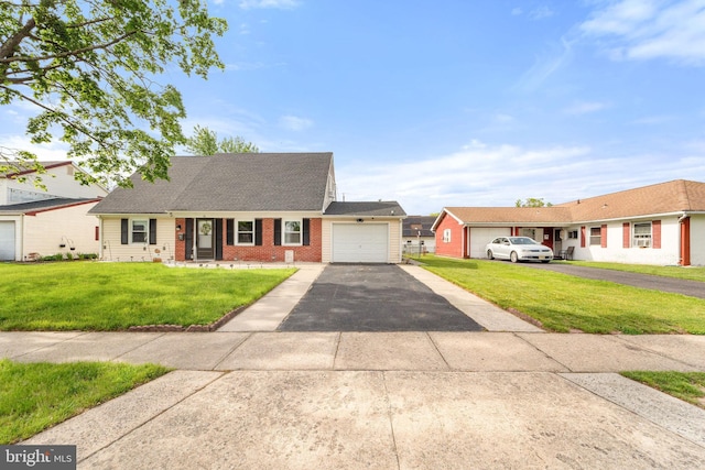 35 Mullshire Ln, Willingboro, NJ 08046 - view of front facade with driveway, a garage, a front lawn, brick siding, and roof with shingles