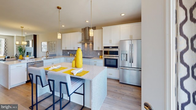 11276 Davisar Rd Unit 80, White Marsh, MD 21162 - kitchen with stainless steel appliances, wall chimney range hood, a peninsula, decorative backsplash, and a sink