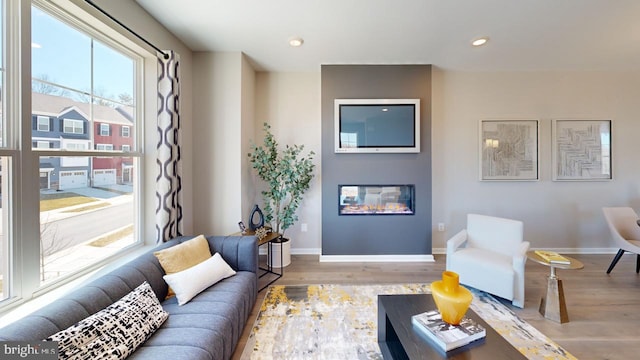 11276 Davisar Rd Unit 80, White Marsh, MD 21162 - living area featuring wood finished floors, a glass covered fireplace, baseboards, and recessed lighting