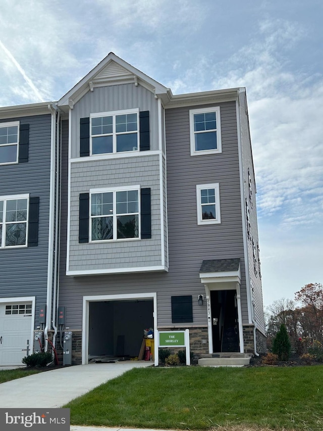 11276 Davisar Rd Unit 80, White Marsh, MD 21162 - townhome / multi-family property featuring an attached garage, driveway, a front lawn, and board and batten siding