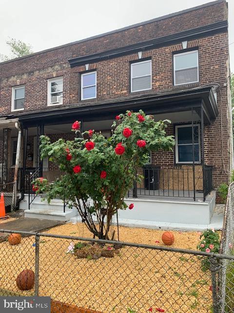 812 Tulip St, Camden, NJ 08104 - view of front of property featuring covered porch and brick siding