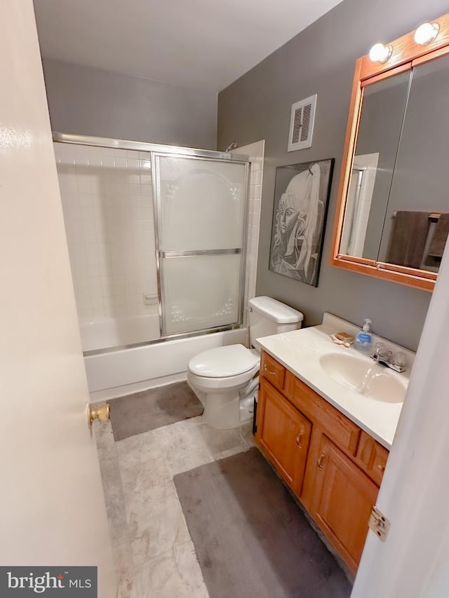 737 Hardwick Pl, York, PA 17404 - full bathroom featuring vanity, toilet, and bath / shower combo with glass door
