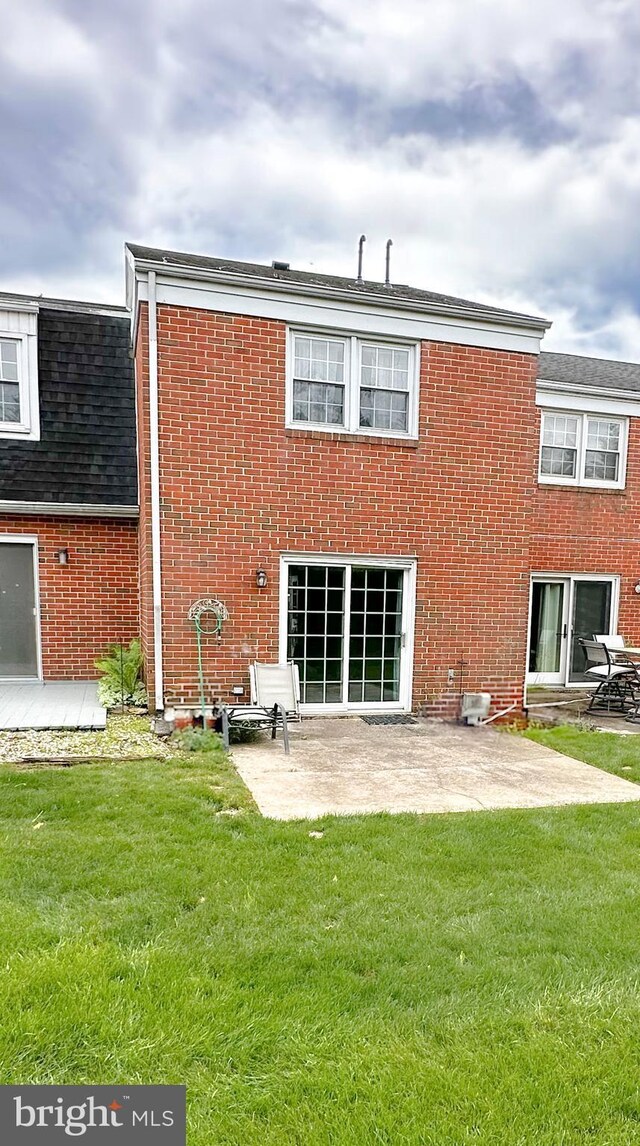 737 Hardwick Pl, York, PA 17404 - back of house with a yard, brick siding, and a patio area