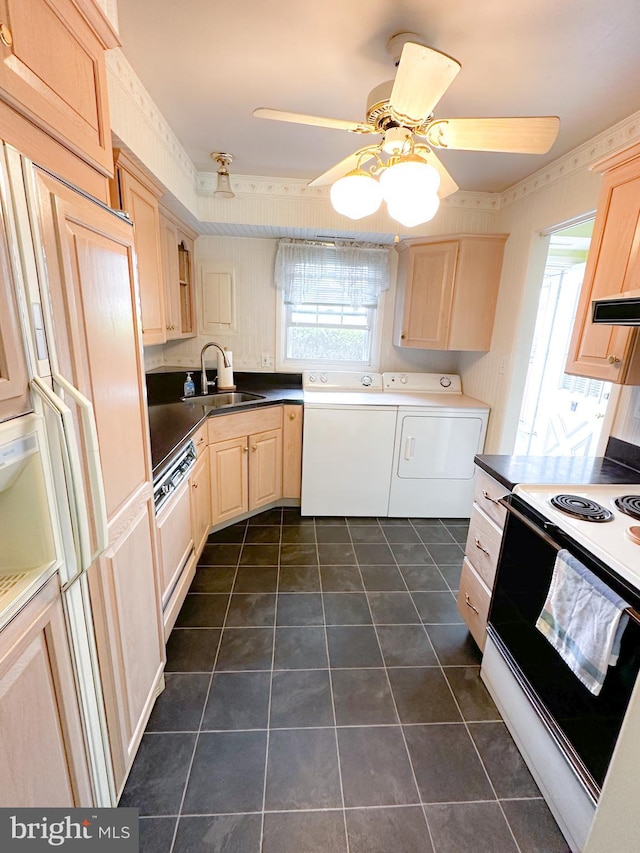 737 Hardwick Pl, York, PA 17404 - kitchen featuring electric range, a sink, washer and clothes dryer, light brown cabinets, and dark countertops