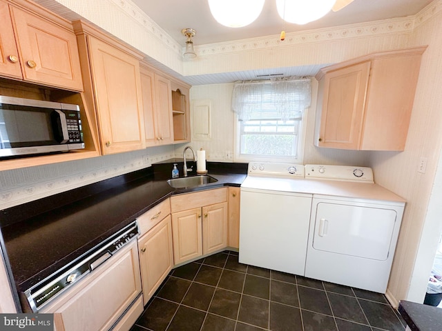 737 Hardwick Pl, York, PA 17404 - washroom with a sink, washer and clothes dryer, and dark tile patterned flooring