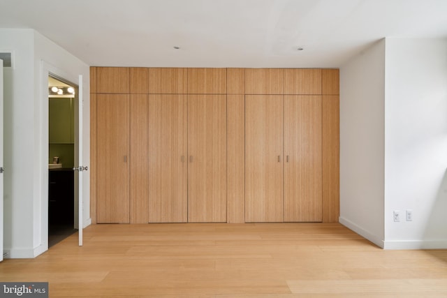 2213 Race St Unit 202, Philadelphia, PA 19103 - unfurnished bedroom featuring light wood-type flooring and baseboards
