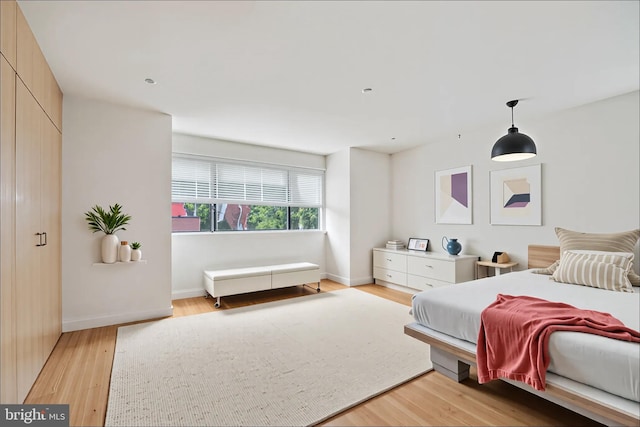 2213 Race St Unit 202, Philadelphia, PA 19103 - bedroom featuring baseboards and light wood-style flooring