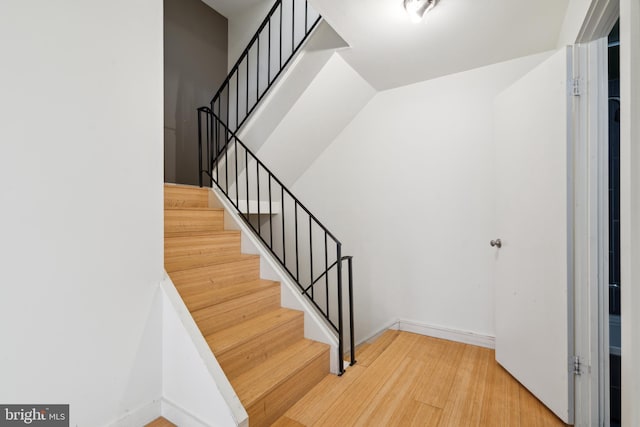 2213 Race St Unit 202, Philadelphia, PA 19103 - staircase with wood finished floors and baseboards