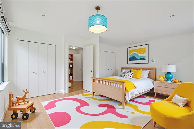 2213 Race St Unit 202, Philadelphia, PA 19103 - bedroom featuring wood finished floors and multiple closets