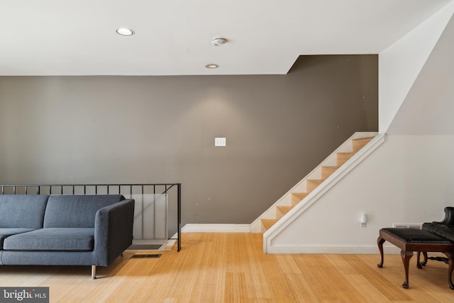 2213 Race St Unit 202, Philadelphia, PA 19103 - sitting room with wood finished floors, recessed lighting, baseboards, and stairway