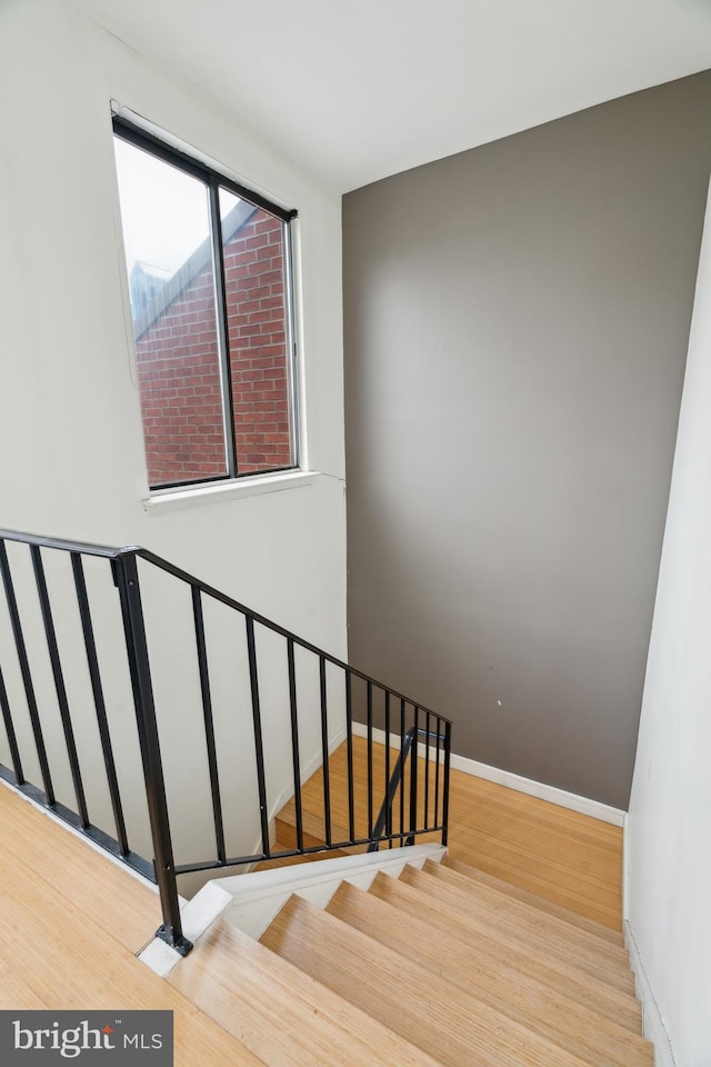 2213 Race St Unit 202, Philadelphia, PA 19103 - stairs featuring wood finished floors and baseboards
