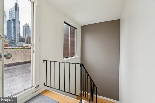 2213 Race St Unit 202, Philadelphia, PA 19103 - staircase with healthy amount of natural light and wood finished floors