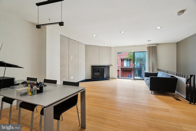 2213 Race St Unit 202, Philadelphia, PA 19103 - living room featuring a fireplace, light wood-style floors, and recessed lighting