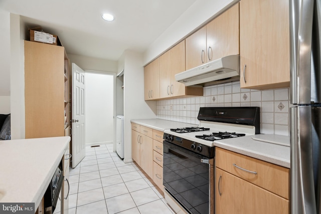 2213 Race St Unit 202, Philadelphia, PA 19103 - kitchen with under cabinet range hood, gas range, freestanding refrigerator, light brown cabinets, and recessed lighting