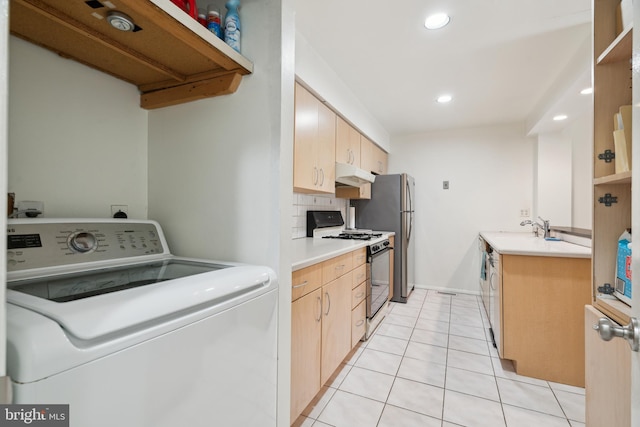 2213 Race St Unit 202, Philadelphia, PA 19103 - laundry area featuring washer / dryer, light tile patterned flooring, and recessed lighting