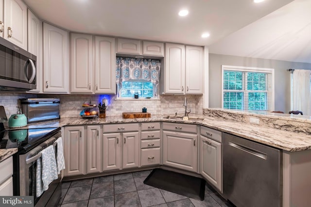 167 Windmill Rd, Willow Grove, PA 19090 - kitchen with appliances with stainless steel finishes, a sink, backsplash, recessed lighting, and dark tile patterned floors