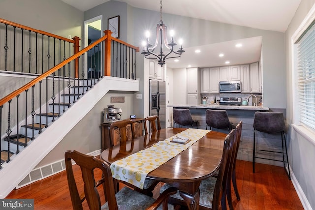 167 Windmill Rd, Willow Grove, PA 19090 - dining space with dark wood-type flooring, a chandelier, lofted ceiling, stairs, and recessed lighting