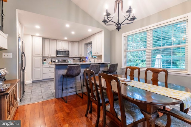 167 Windmill Rd, Willow Grove, PA 19090 - dining area with healthy amount of natural light, recessed lighting, light wood finished floors, a chandelier, and vaulted ceiling