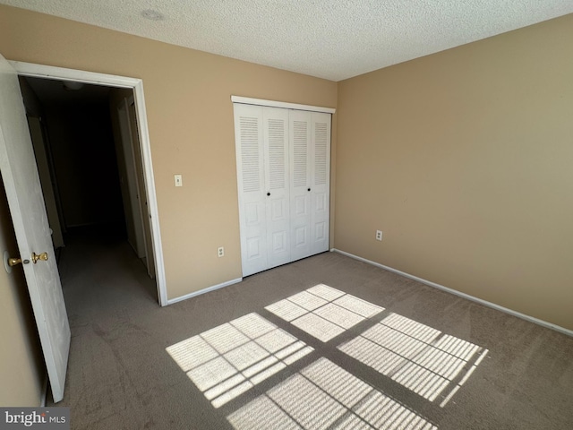 86 Oneill Ct, Trenton, NJ 08648 - unfurnished bedroom with carpet flooring, a closet, a textured ceiling, and baseboards