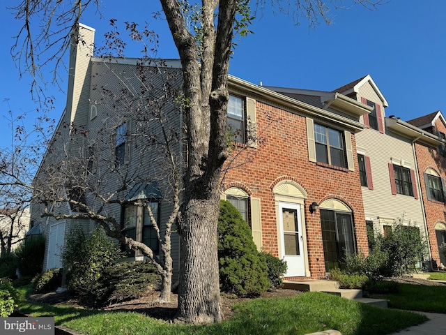 86 Oneill Ct, Trenton, NJ 08648 - view of front of house with brick siding and a chimney