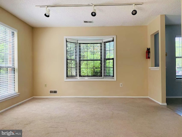 86 Oneill Ct, Trenton, NJ 08648 - carpeted spare room with rail lighting and baseboards