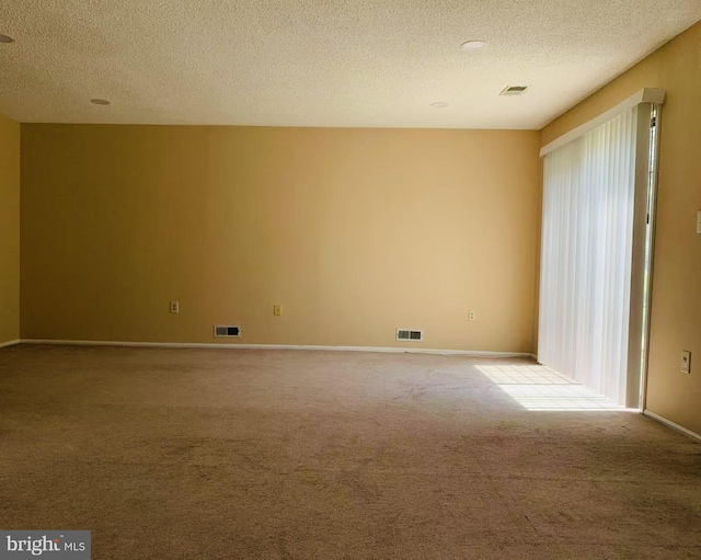 86 Oneill Ct, Trenton, NJ 08648 - carpeted empty room featuring a textured ceiling and baseboards