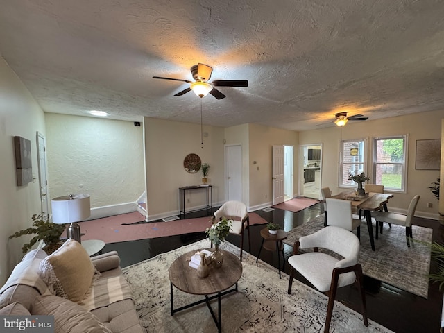 2411 N W St, Wilmington, DE 19802 - living room featuring ceiling fan, baseboards, and a textured ceiling