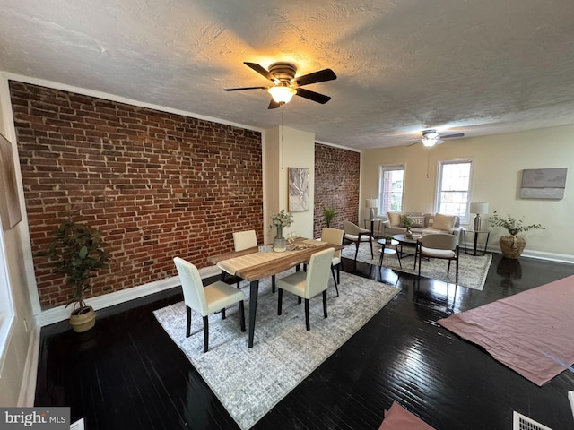 2411 N W St, Wilmington, DE 19802 - dining space featuring ceiling fan, brick wall, baseboards, a textured ceiling, and hardwood / wood-style flooring