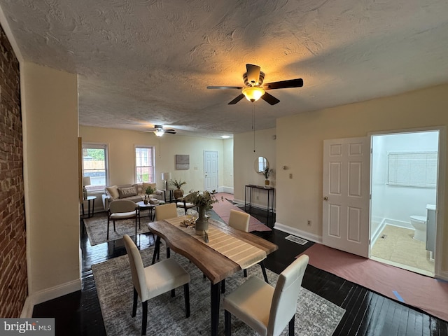 2411 N W St, Wilmington, DE 19802 - dining room with a ceiling fan, dark wood-type flooring, a textured ceiling, and baseboards