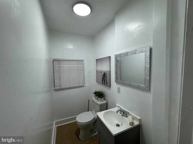 2411 N W St, Wilmington, DE 19802 - bathroom featuring vanity, toilet, and baseboards