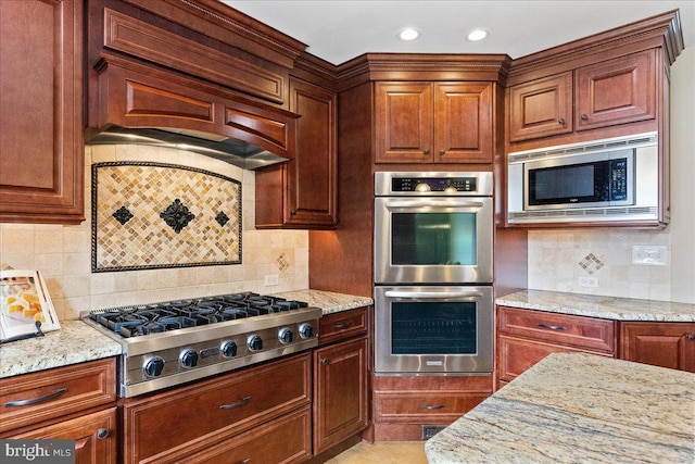 25 Ginnie Ln, West Windsor, NJ 08550 - kitchen with stainless steel appliances, light stone counters, backsplash, recessed lighting, and premium range hood