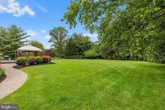 25 Ginnie Ln, West Windsor, NJ 08550 - view of grassy yard featuring a gazebo