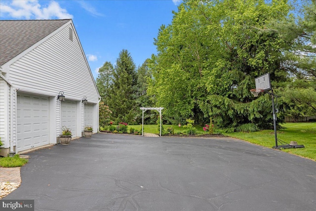 25 Ginnie Ln, West Windsor, NJ 08550 - view of patio with asphalt driveway and a garage