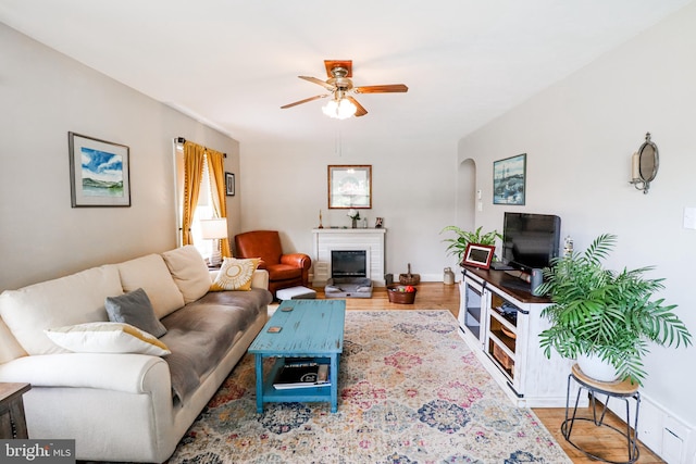 72 Springs Ave, Gettysburg, PA 17325 - living room with ceiling fan, wood finished floors, a fireplace, and baseboards
