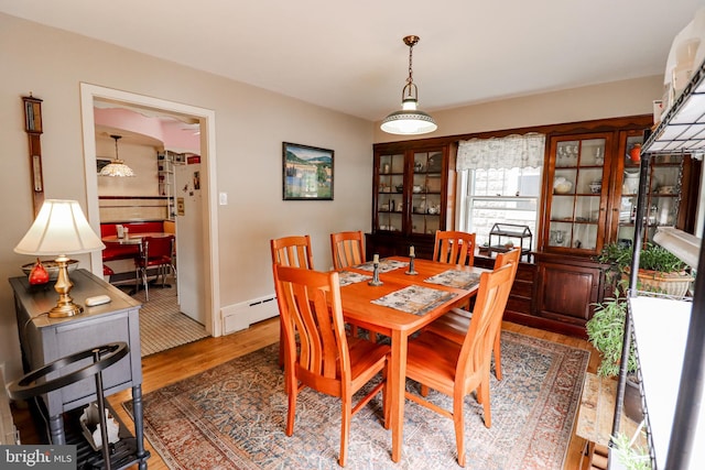 72 Springs Ave, Gettysburg, PA 17325 - dining area featuring baseboard heating and wood finished floors