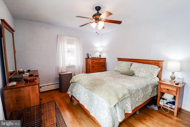72 Springs Ave, Gettysburg, PA 17325 - bedroom with a baseboard radiator, wood finished floors, and a ceiling fan