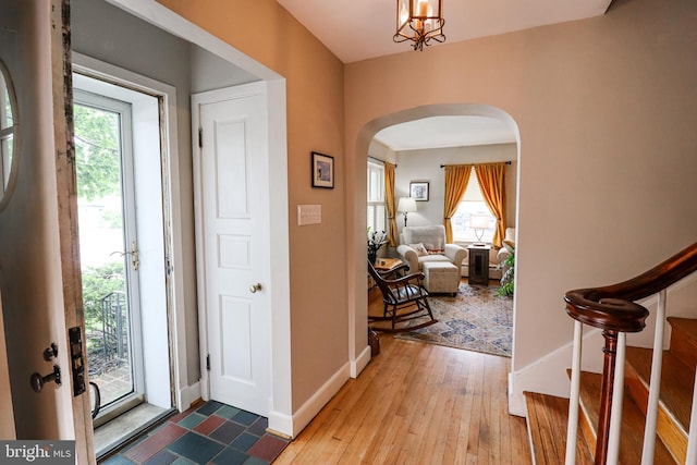 72 Springs Ave, Gettysburg, PA 17325 - foyer entrance featuring arched walkways, plenty of natural light, wood-type flooring, and baseboards