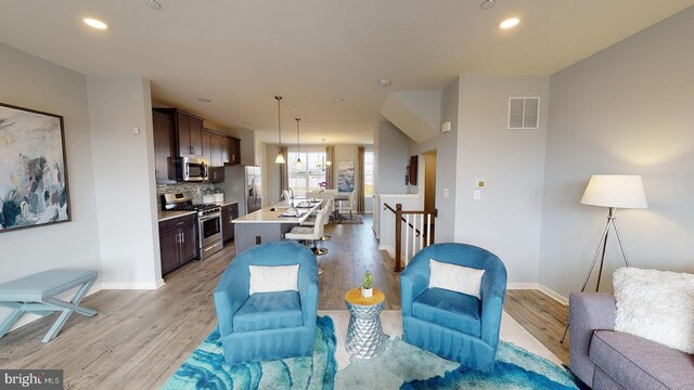 11274 Davisar Rd, White Marsh, MD 21162 - living area with light wood finished floors, baseboards, and recessed lighting