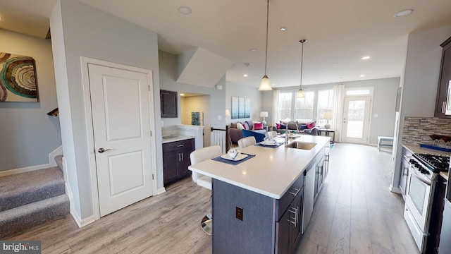 11274 Davisar Rd, White Marsh, MD 21162 - kitchen featuring a sink, open floor plan, light wood-style floors, light countertops, and recessed lighting