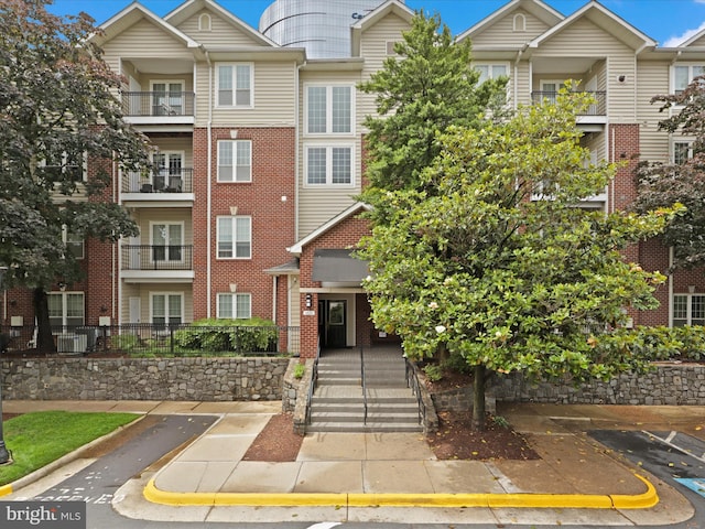 1521 Spring Gate Dr Unit 10308, Mclean, VA 22102 - view of front facade with brick siding and uncovered parking