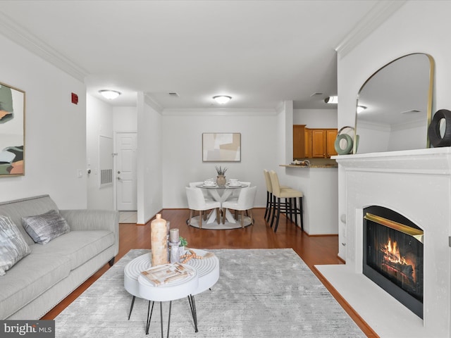 1521 Spring Gate Dr Unit 10308, Mclean, VA 22102 - living room featuring wood finished floors, crown molding, and a fireplace with flush hearth