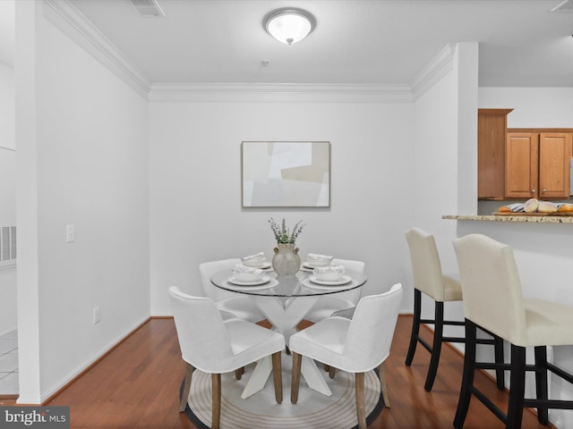 1521 Spring Gate Dr Unit 10308, Mclean, VA 22102 - dining area with ornamental molding, dark wood-type flooring, and baseboards